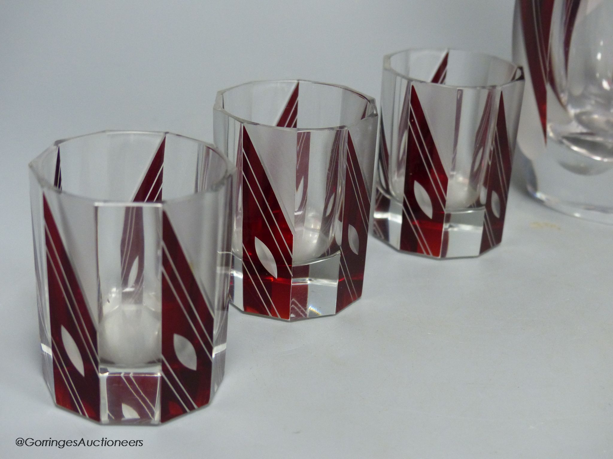 A Bohemian Art Deco ruby flash glass seven piece liqueur set, decanter 32cm